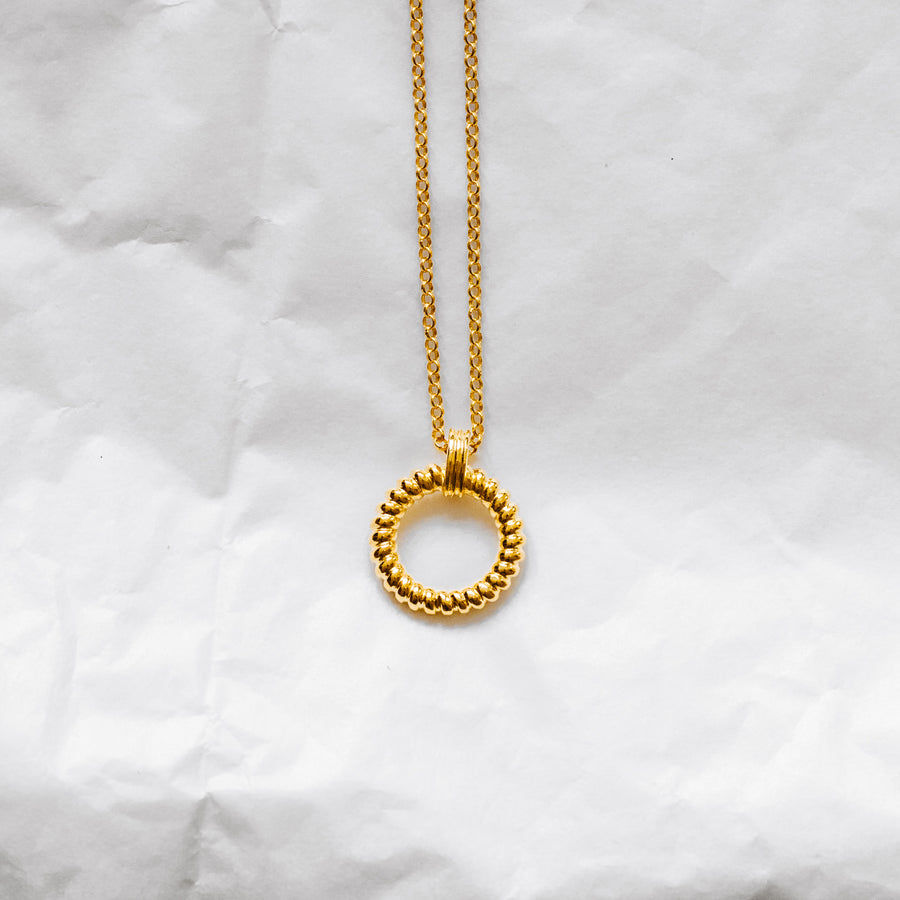 twisted circle ring gold pendant necklace