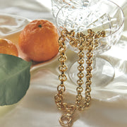 chunky rolo chain signoretti clasp 18 karat gold vermeil oranges jewellery flat lay